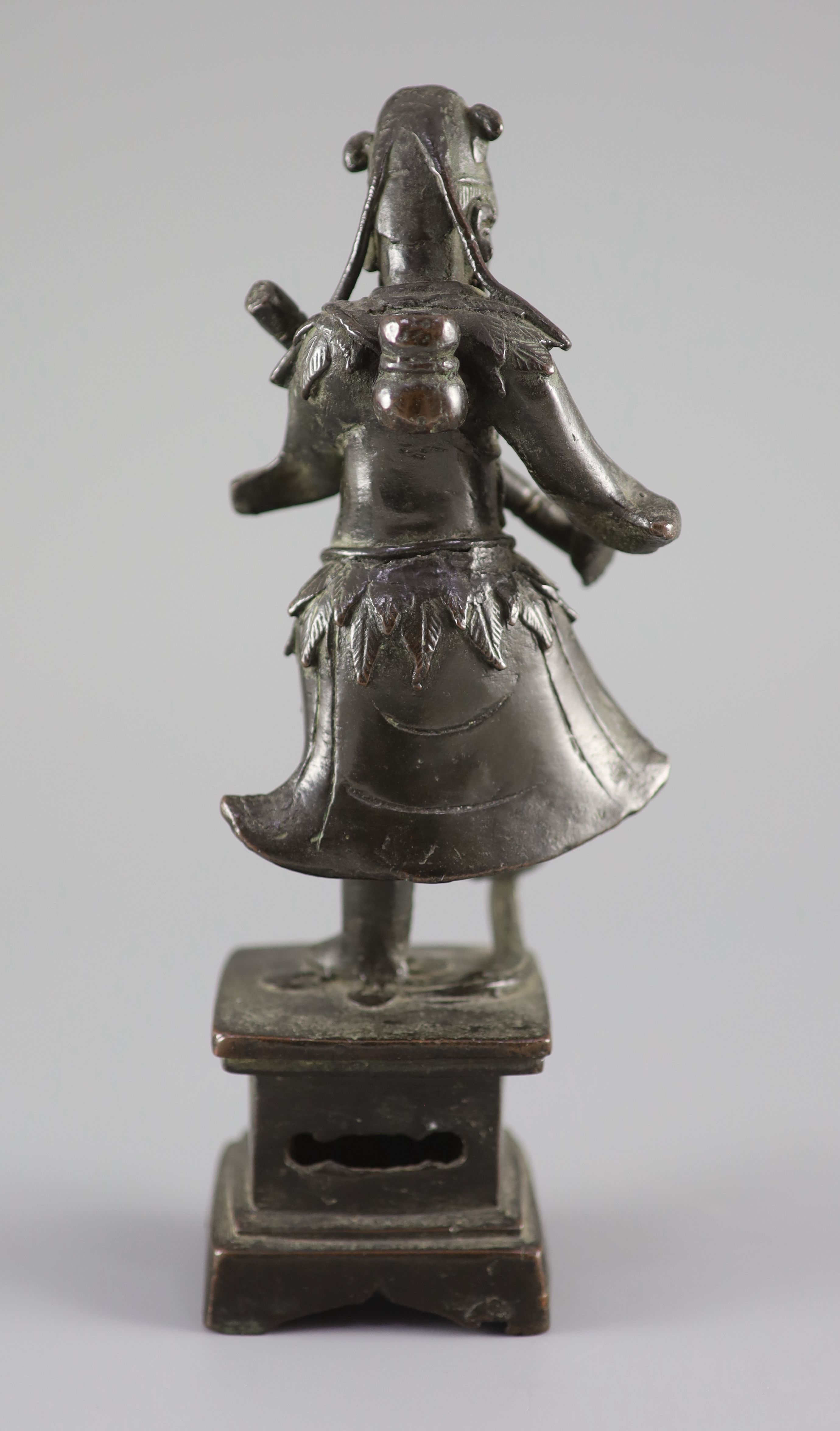 A Chinese bronze figure of an immortal, late Ming dynasty, 23 cm high